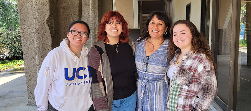 LibroMobile Arts Cooperative founder Sarah Rafael García (center right) with UCI students Kaye Regalado (left), Inez Rosales (center left), and Chloe Ford (right).