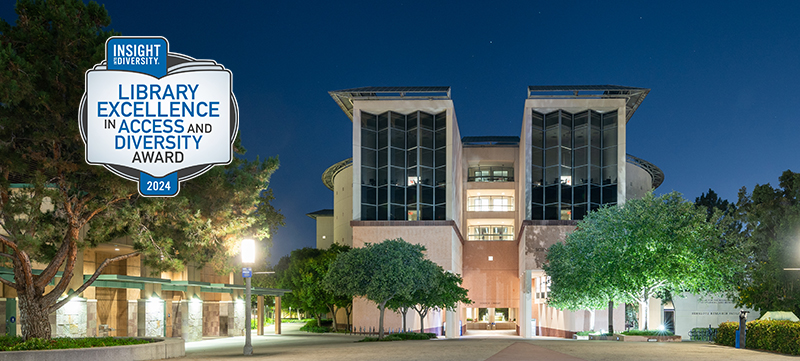 UCI Science Library at night with Library Excellence in Access and Diversity LEAD Award logo
