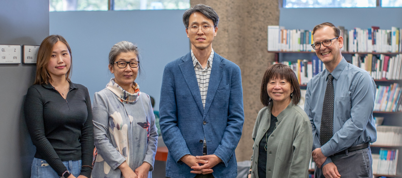 Siyoung Choi, Ying Zhang, Changshik Yoon, Lorelei Tanji, and Kevin Ruminson in the Langson Library Korea Corner.