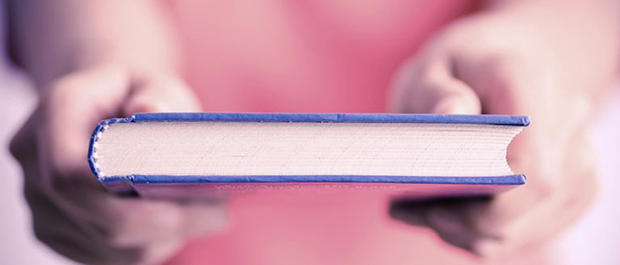 Hands holding a book