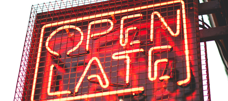Red neon sign that reads "open late"