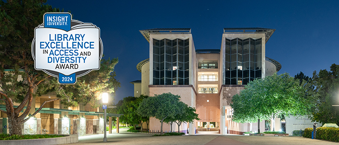 UCI Science Library at night with Insight Into Diversity LEAD award logo