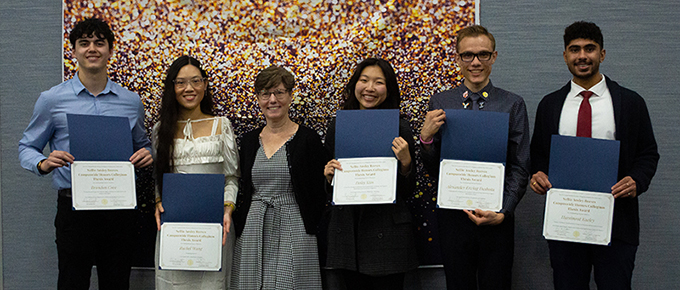 Nellie Ansley Reeves Award recipients holding award certificates with UCI Libraries Head of Reference Cynthia Johnson